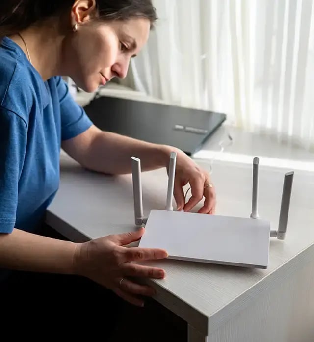 Woman sets up home modem.
